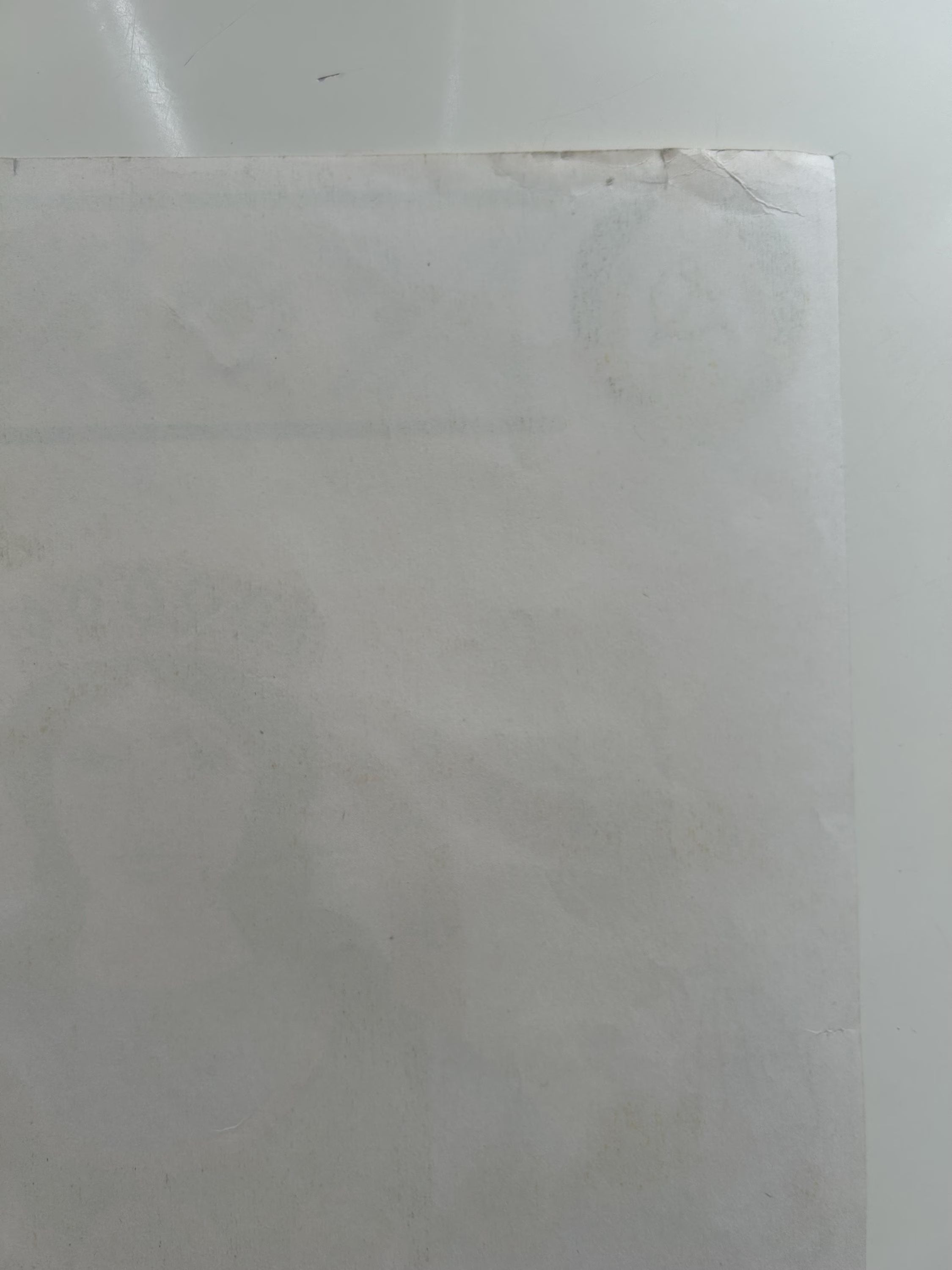 Close-up of a light gray marble tile with visible veins