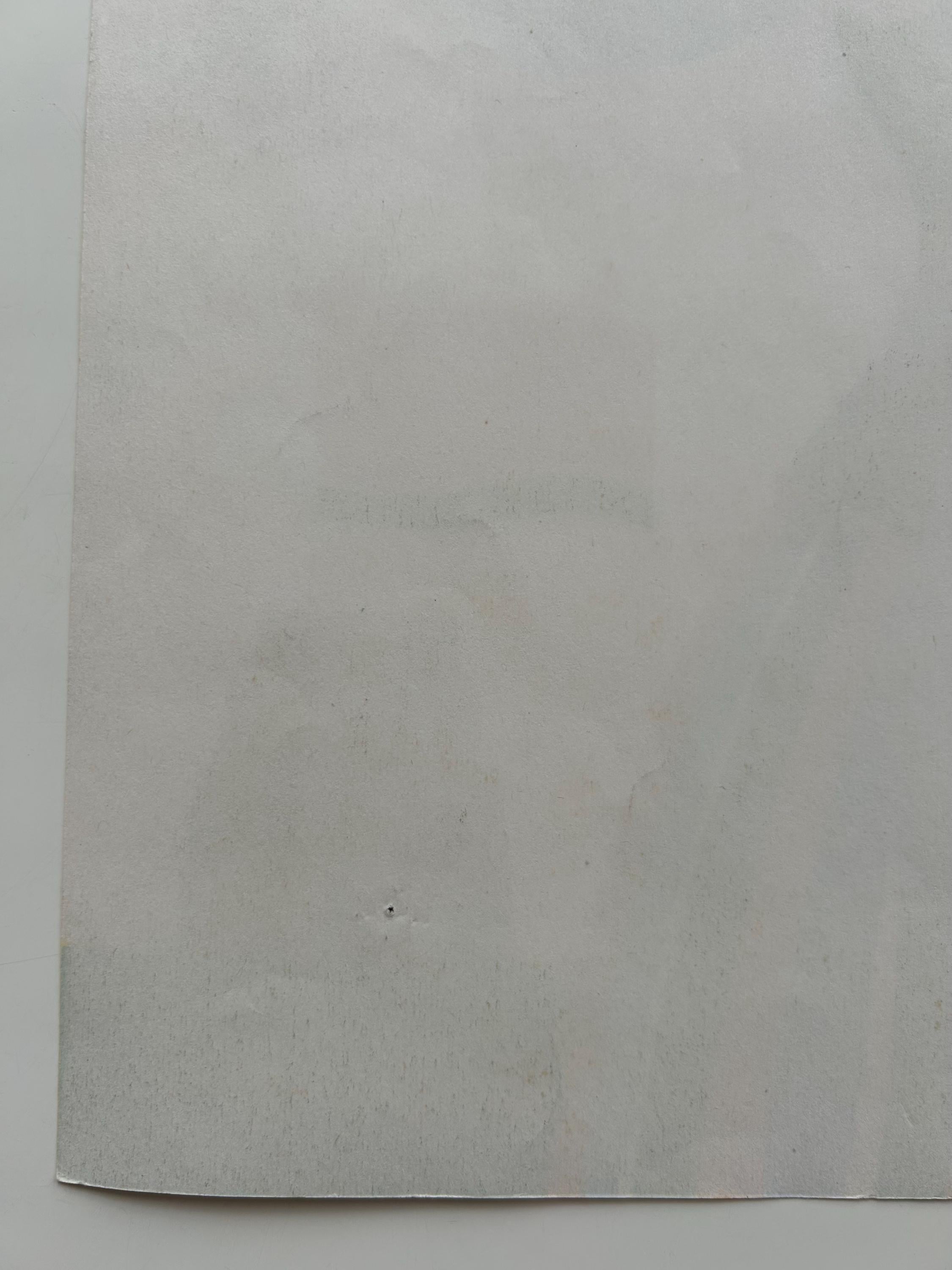 Plain gray sheet of paper on a white background