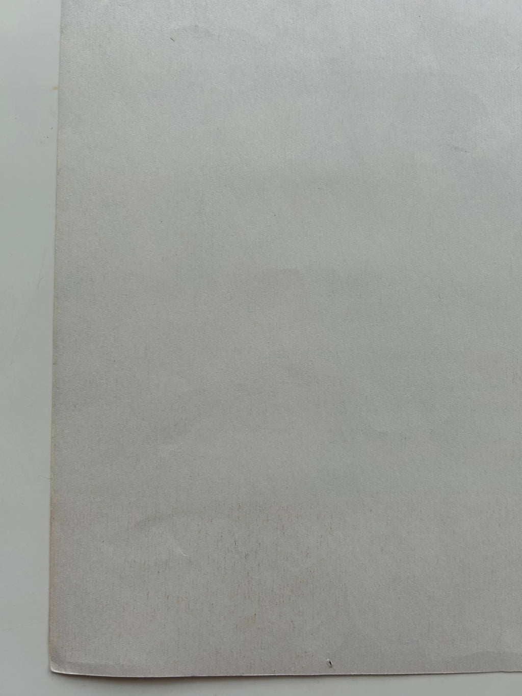 Gray textured paper on a white background