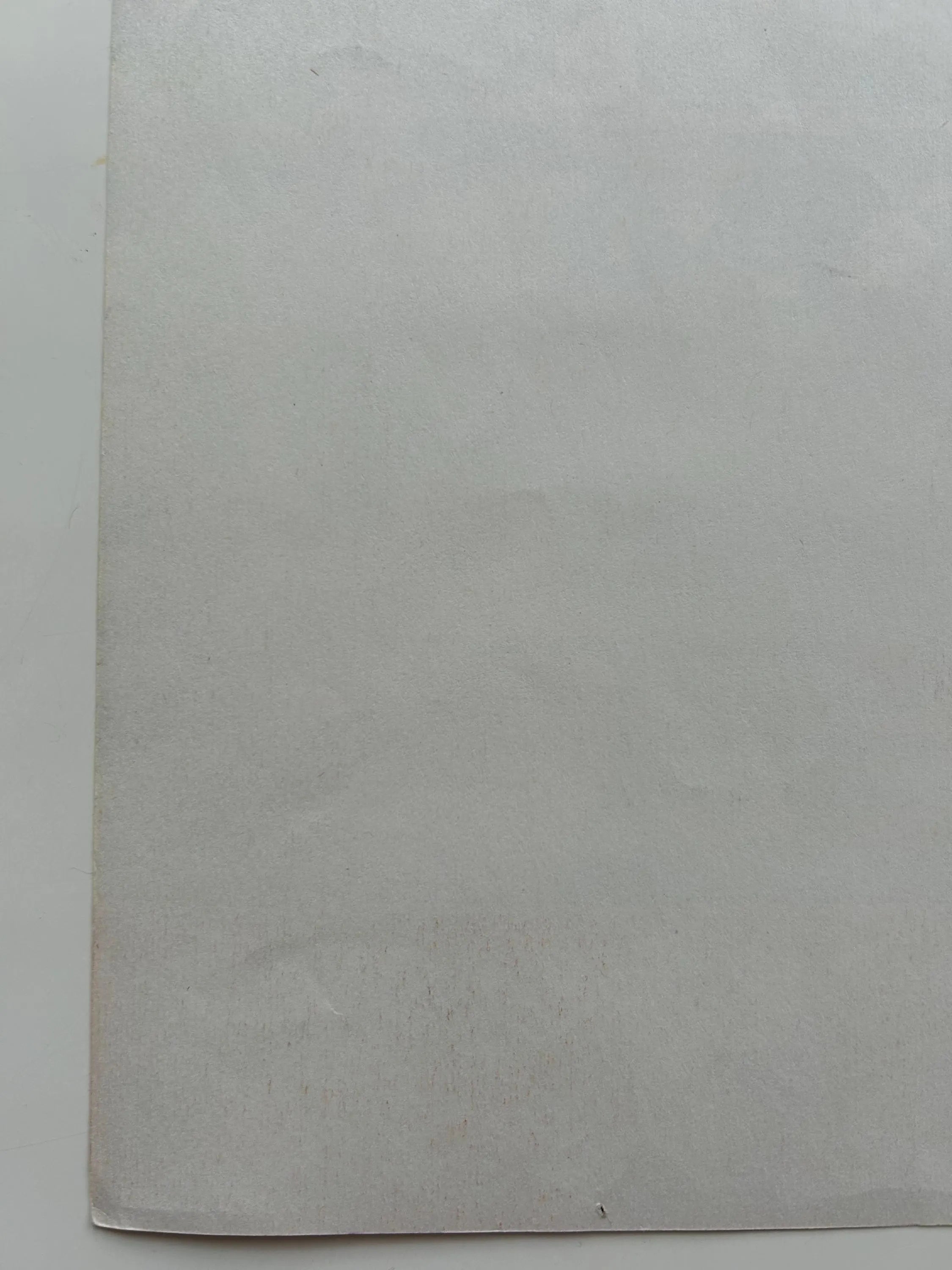 Gray textured paper on a white background
