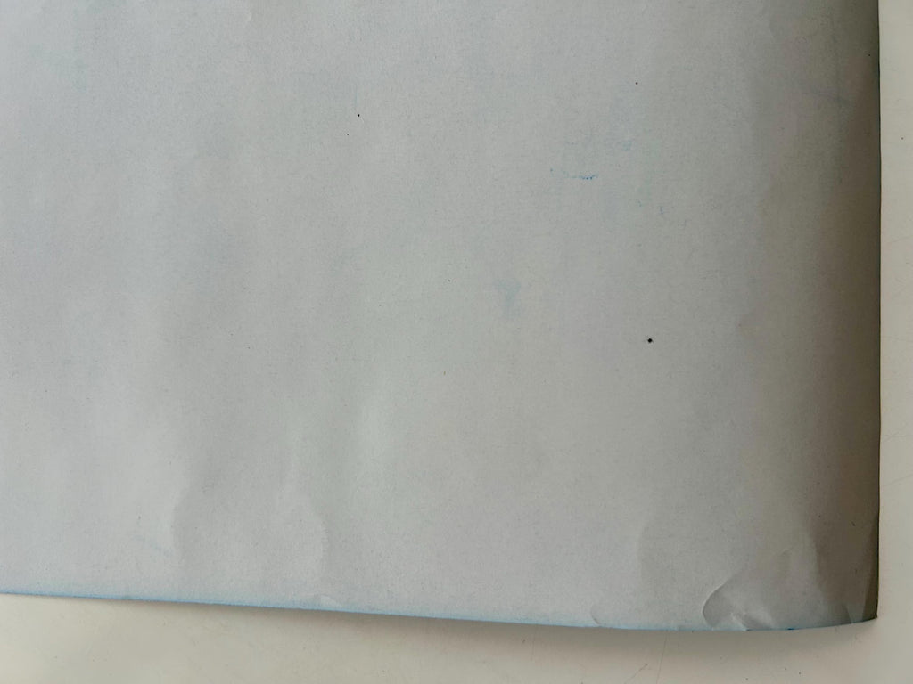 White paper with blue border on a white background