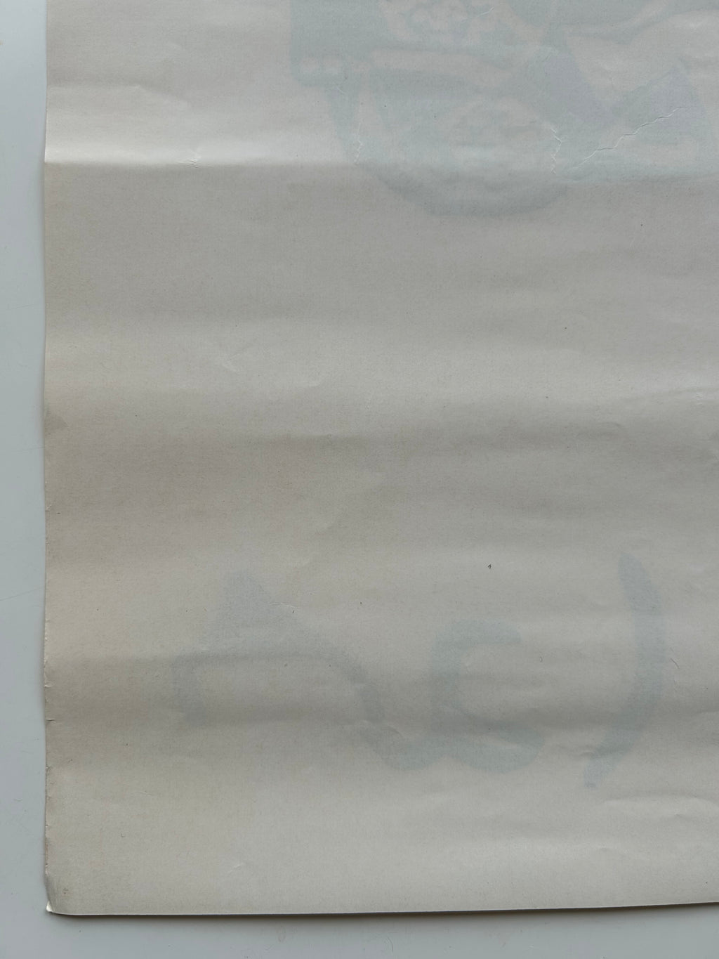 Plain beige paper on a light gray background