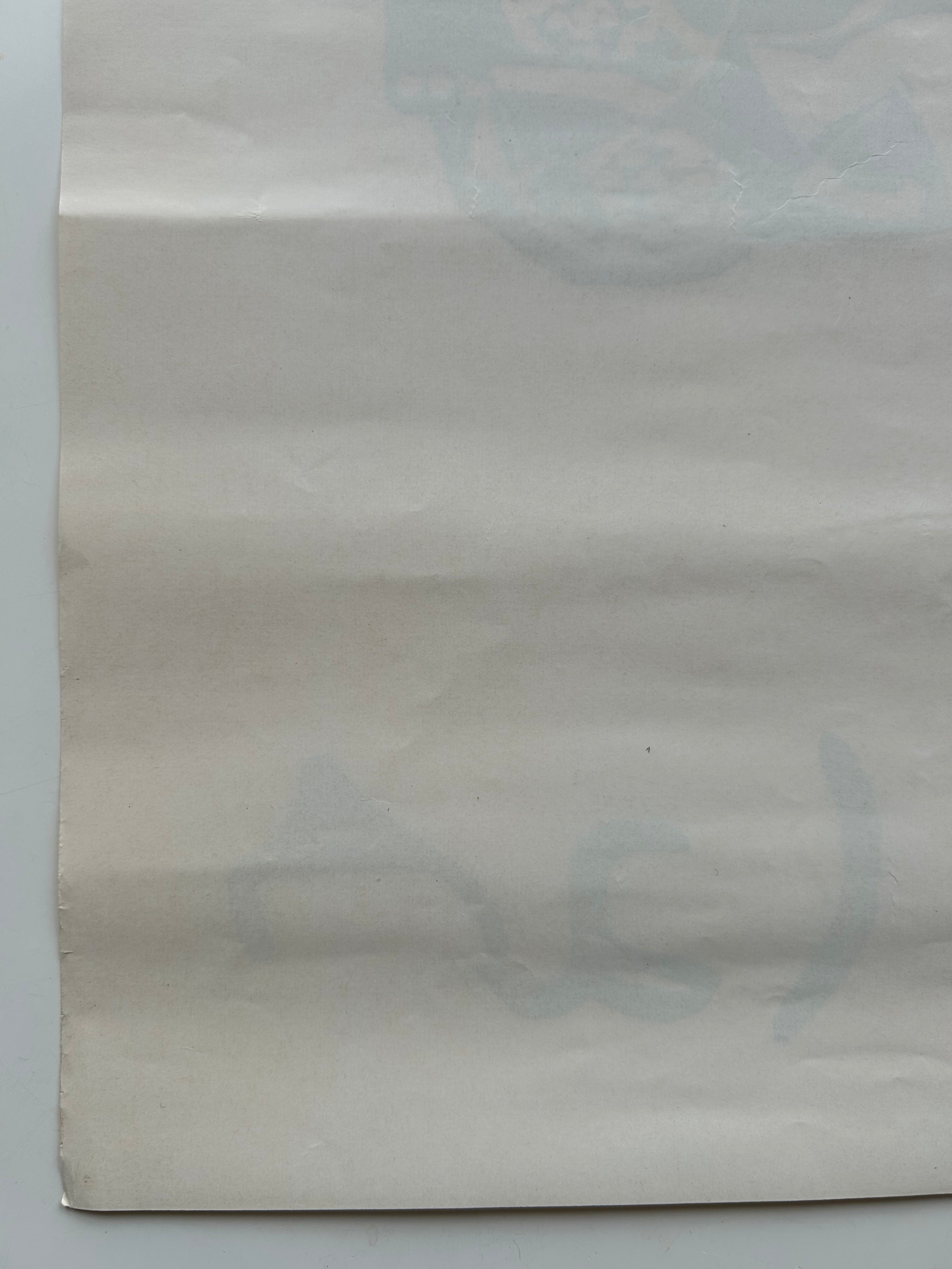 Plain beige paper on a light gray background