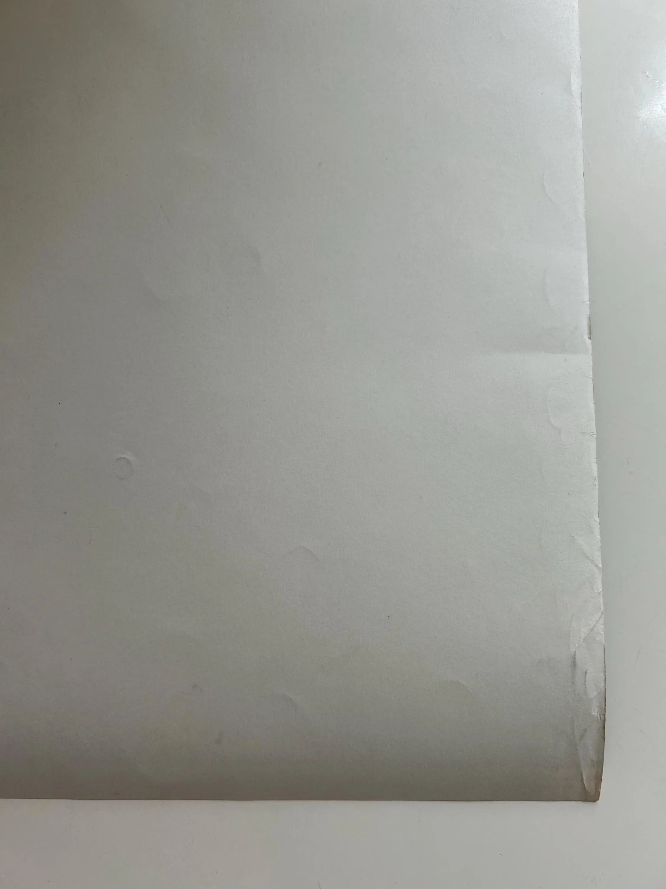 Close-up of a roll of white paper on a white background
