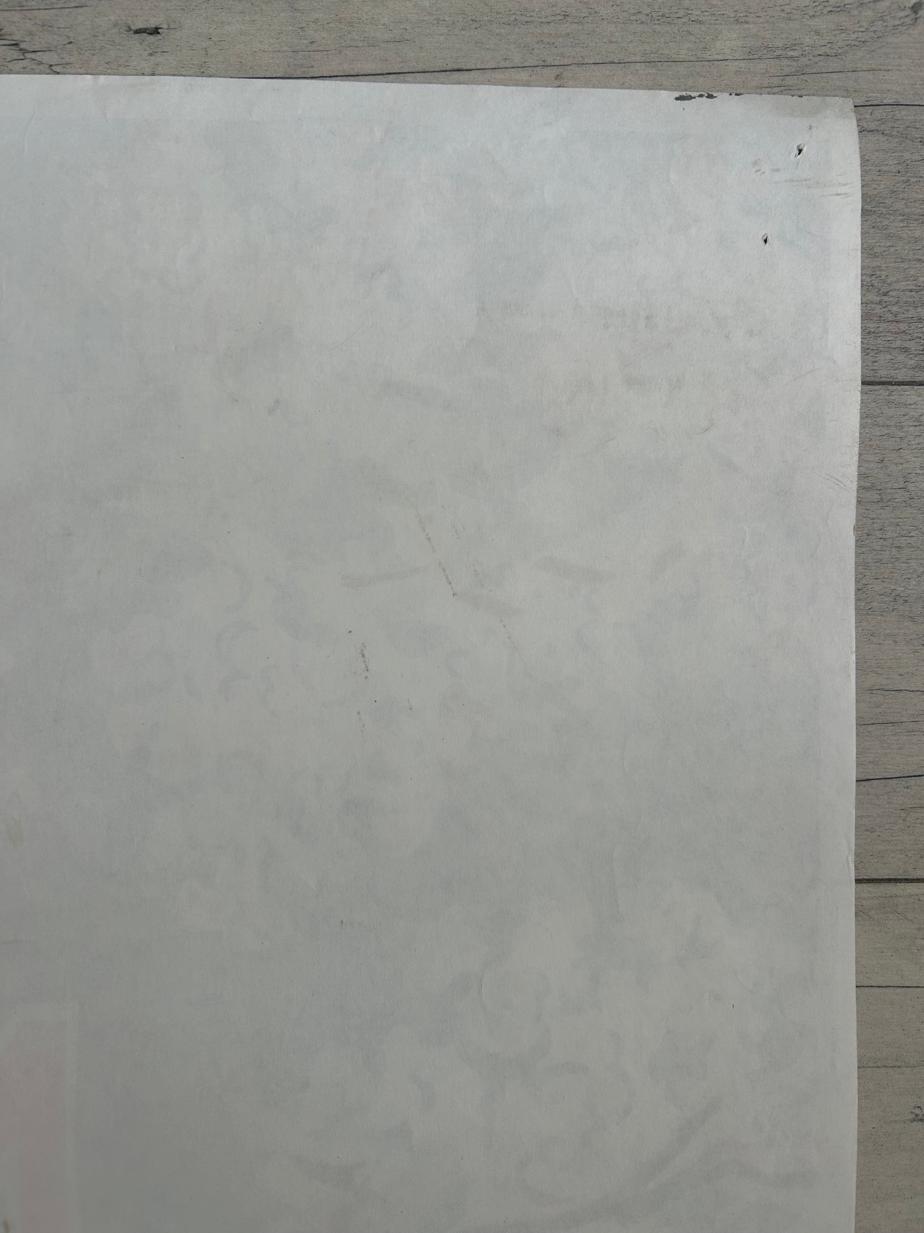 Sheet of white paper on a wooden surface