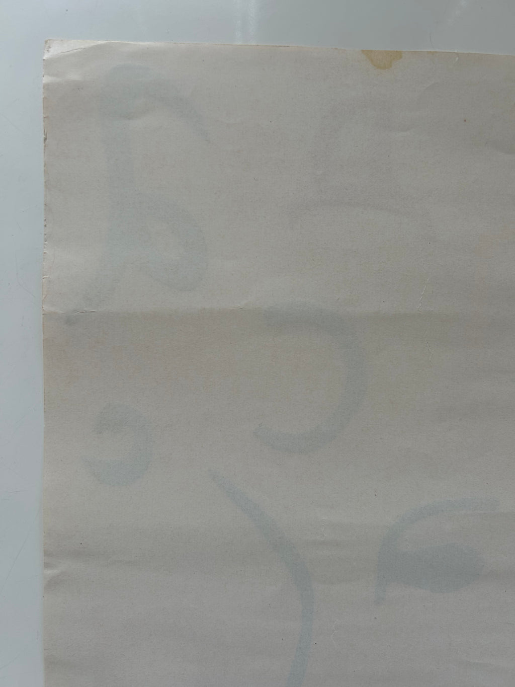 Close-up of a textured beige fabric with a white background