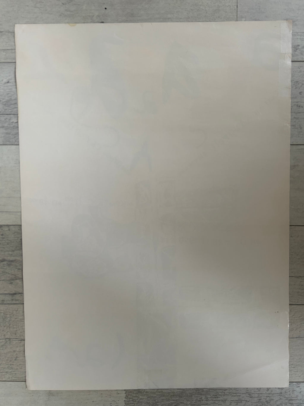 Plain white sheet on a textured gray background