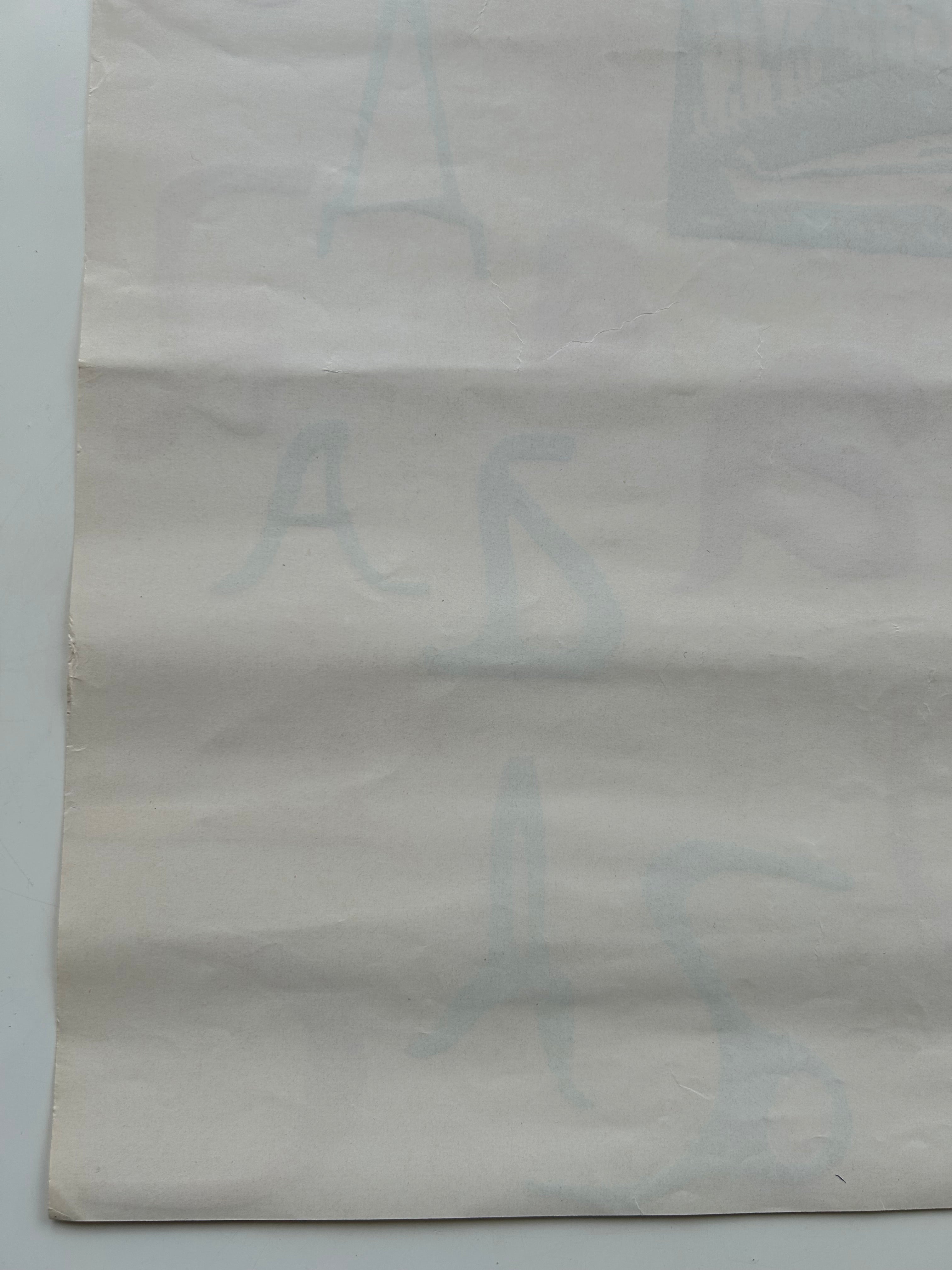 Textured gray paper with a subtle pattern on a light gray background