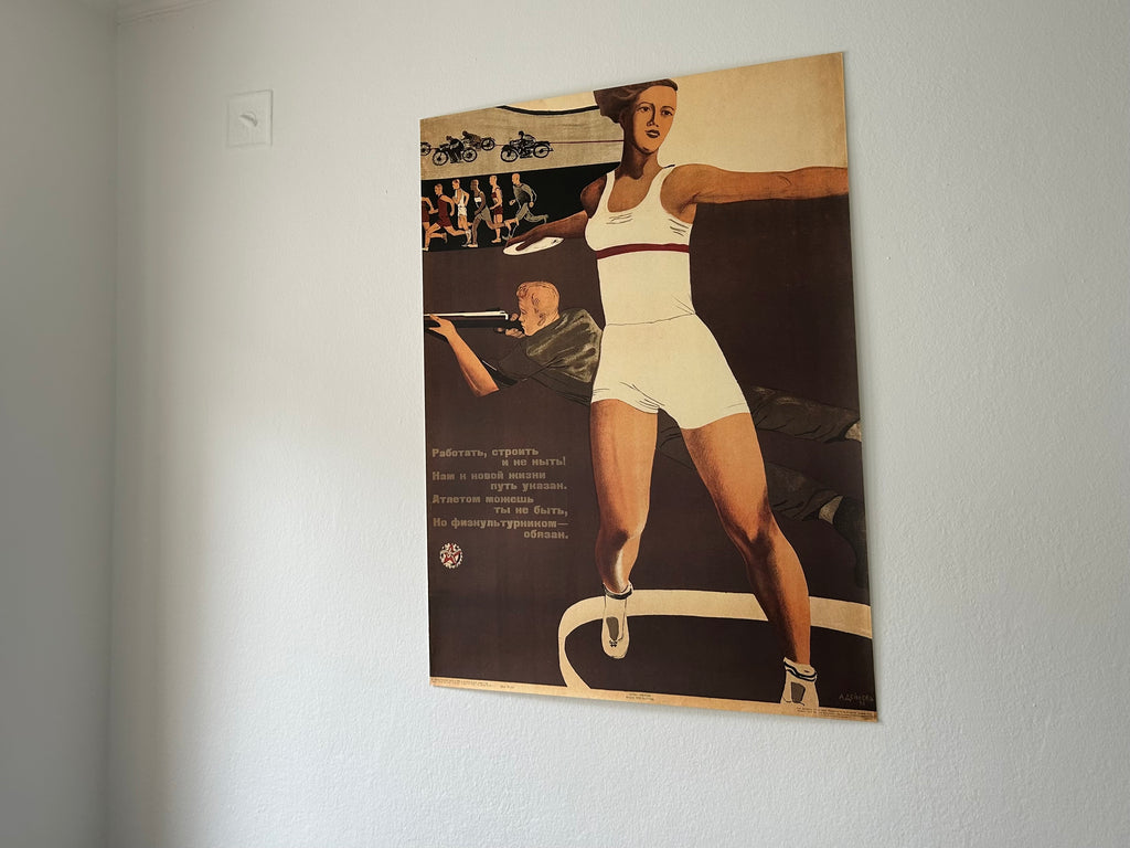 Vintage-style poster of a woman in athletic wear on a plain wall.
