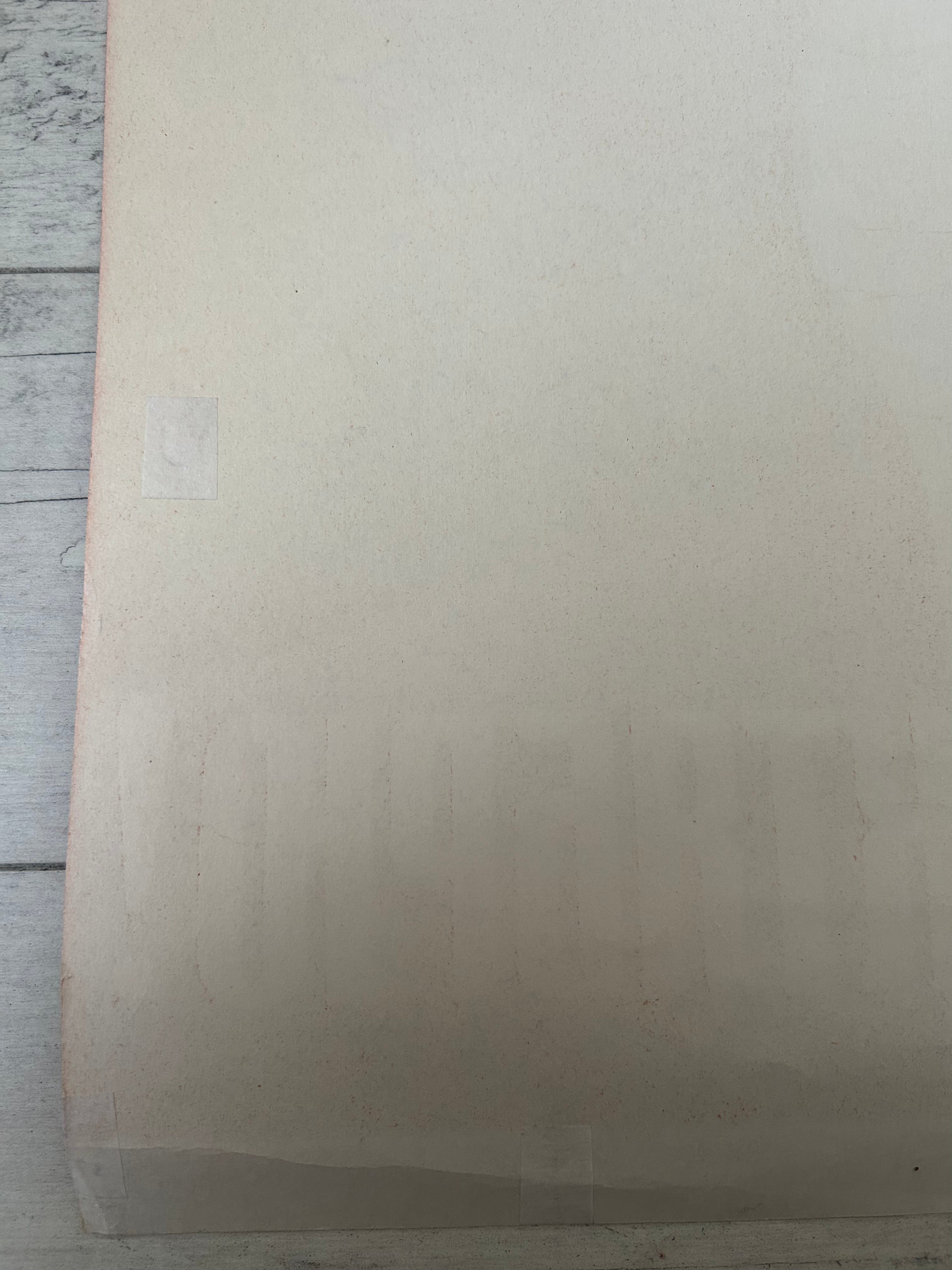 Beige textured paper on a wooden surface