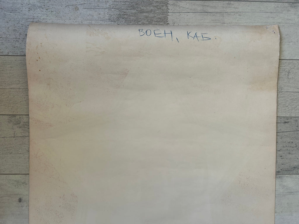 Large piece of brown paper with text on a wooden surface