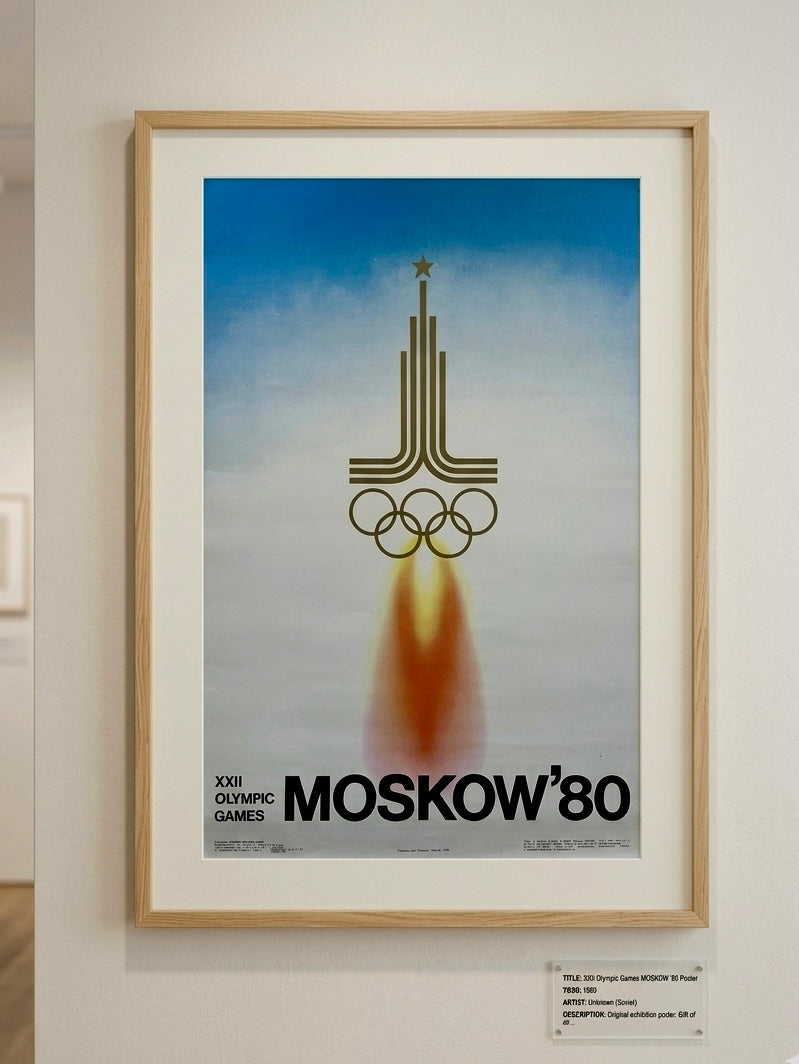 Framed poster of the 1980 Moscow Olympics with a rocket and Olympic rings design.
