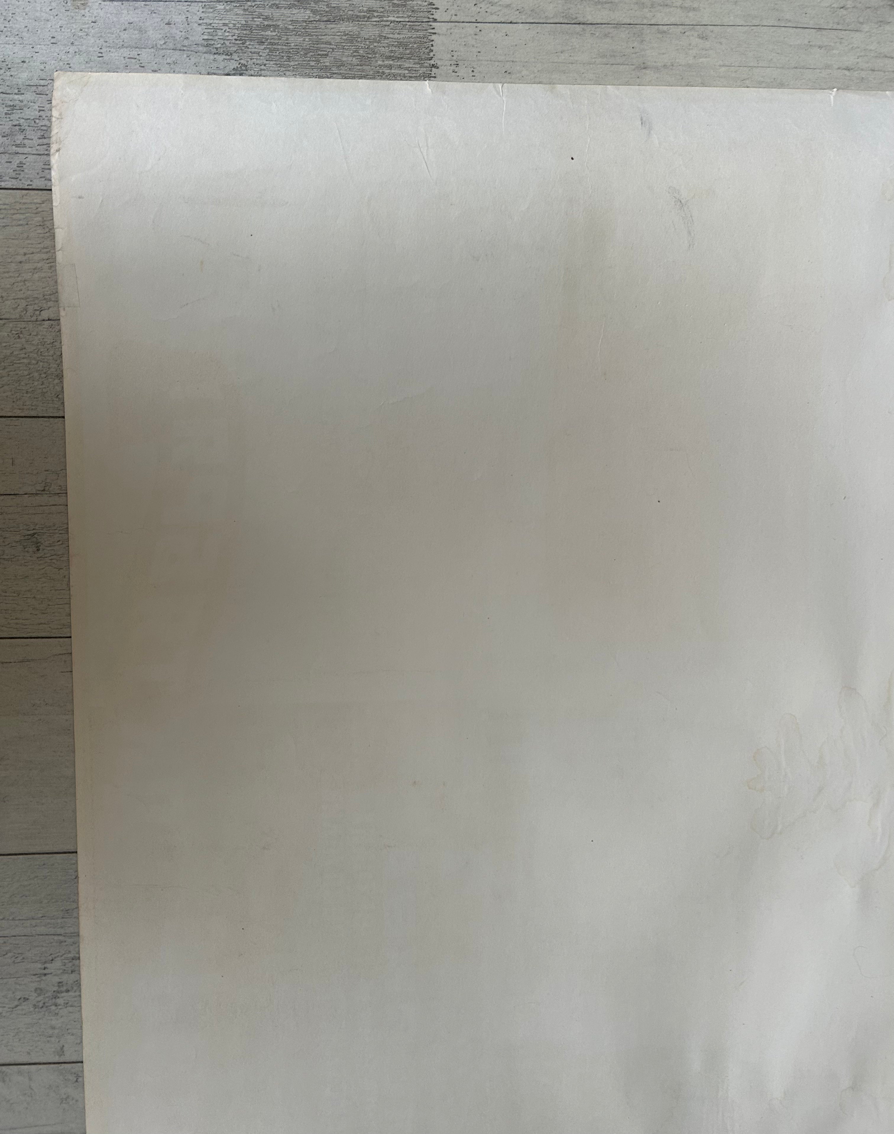 White sheet of paper on a wooden surface