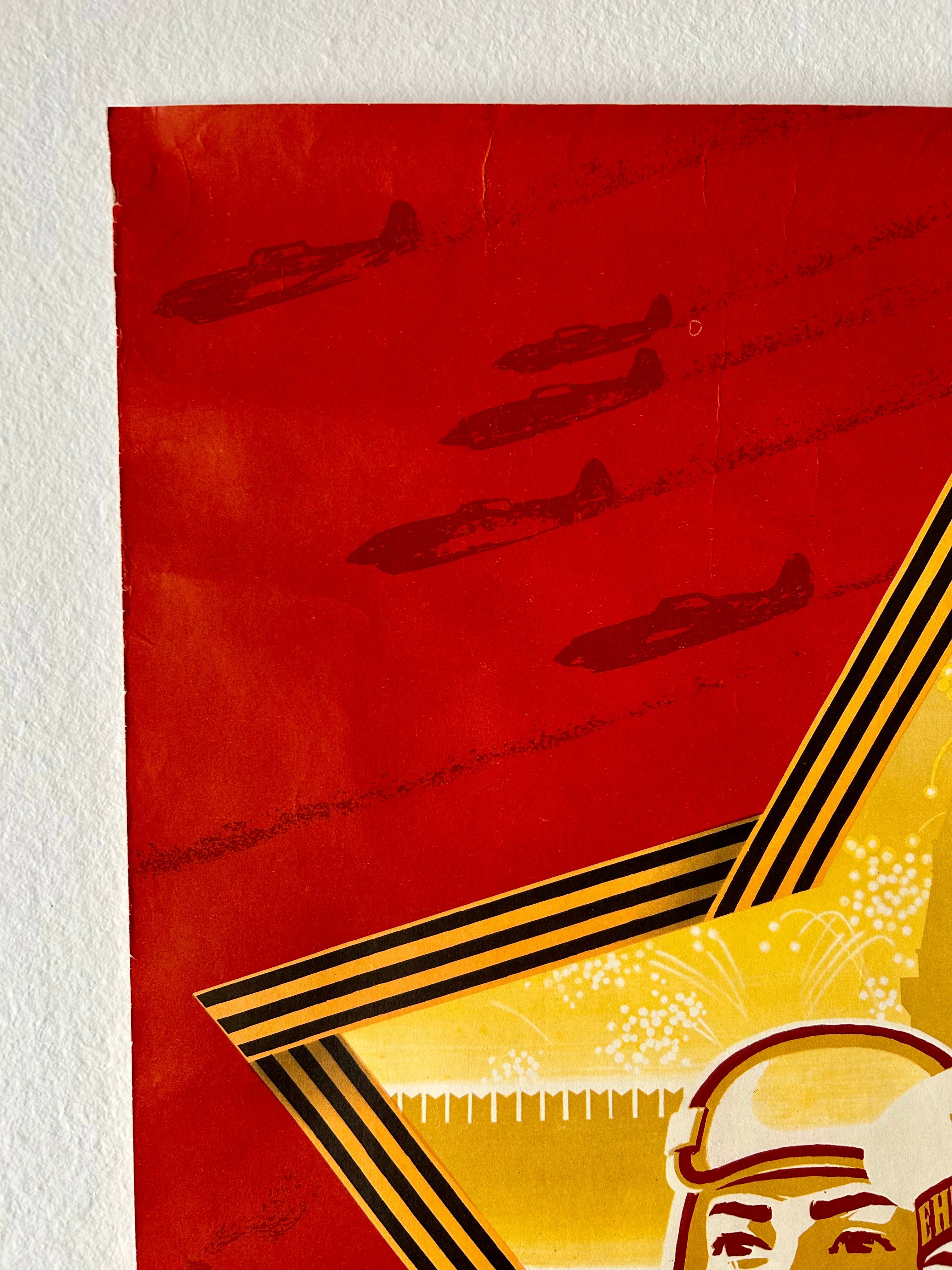 Vintage-style poster with red background, black airplanes, and a gold emblem featuring a face.