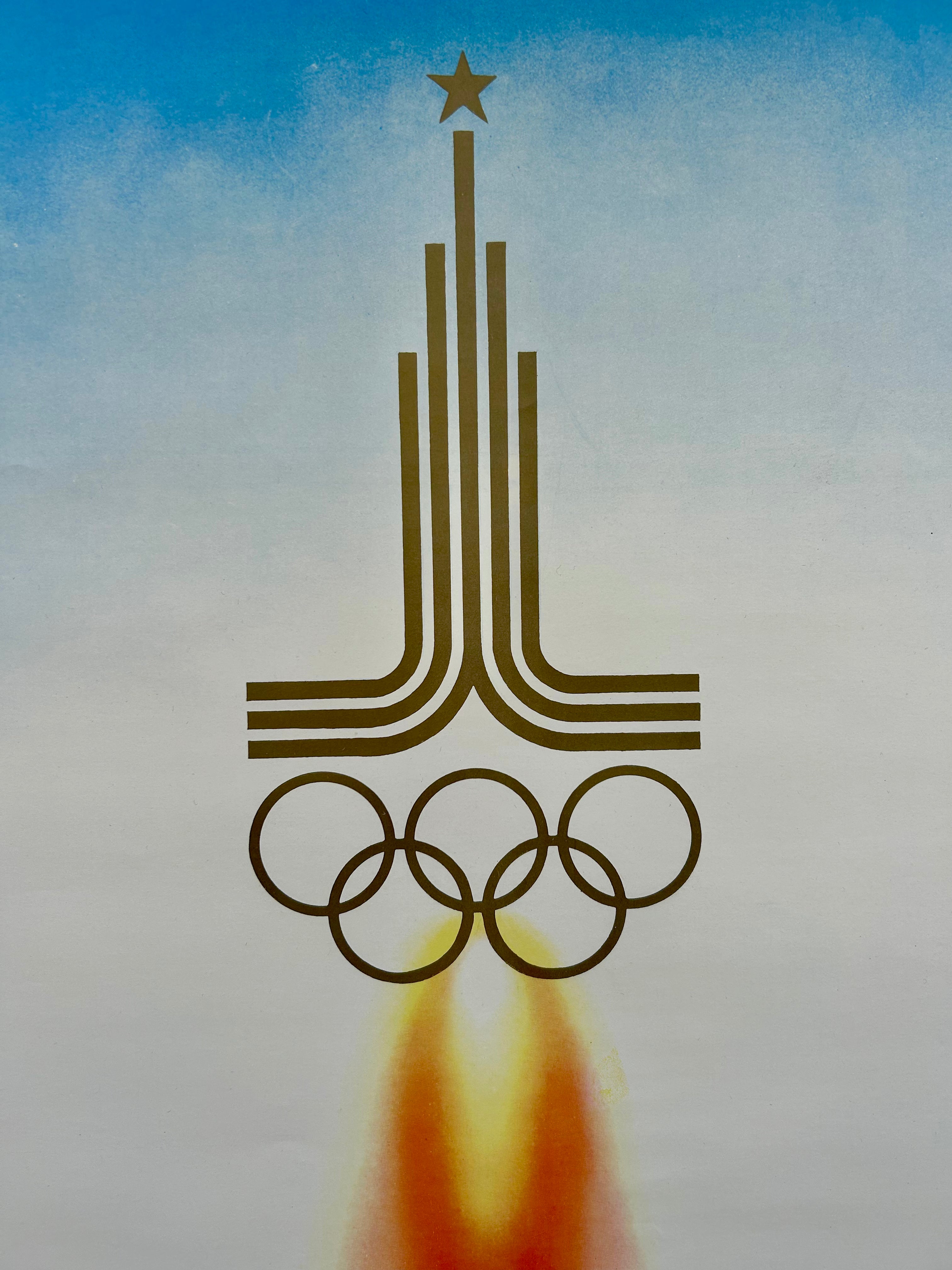 Olympic logo with rings and star on a blue and gray gradient background