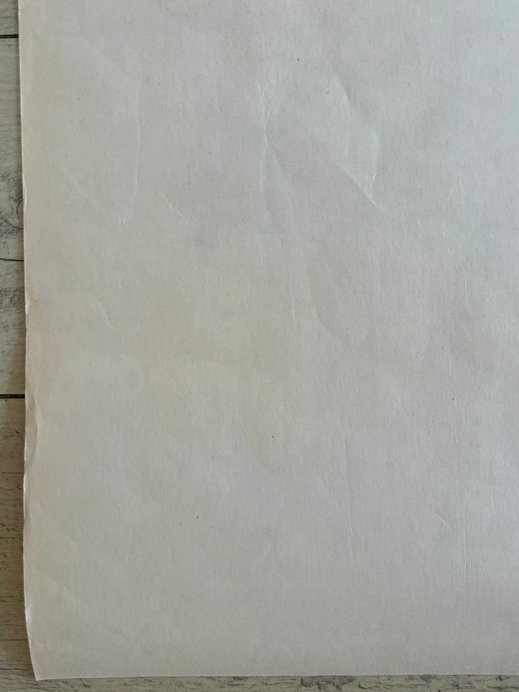 Beige paper on a wooden surface