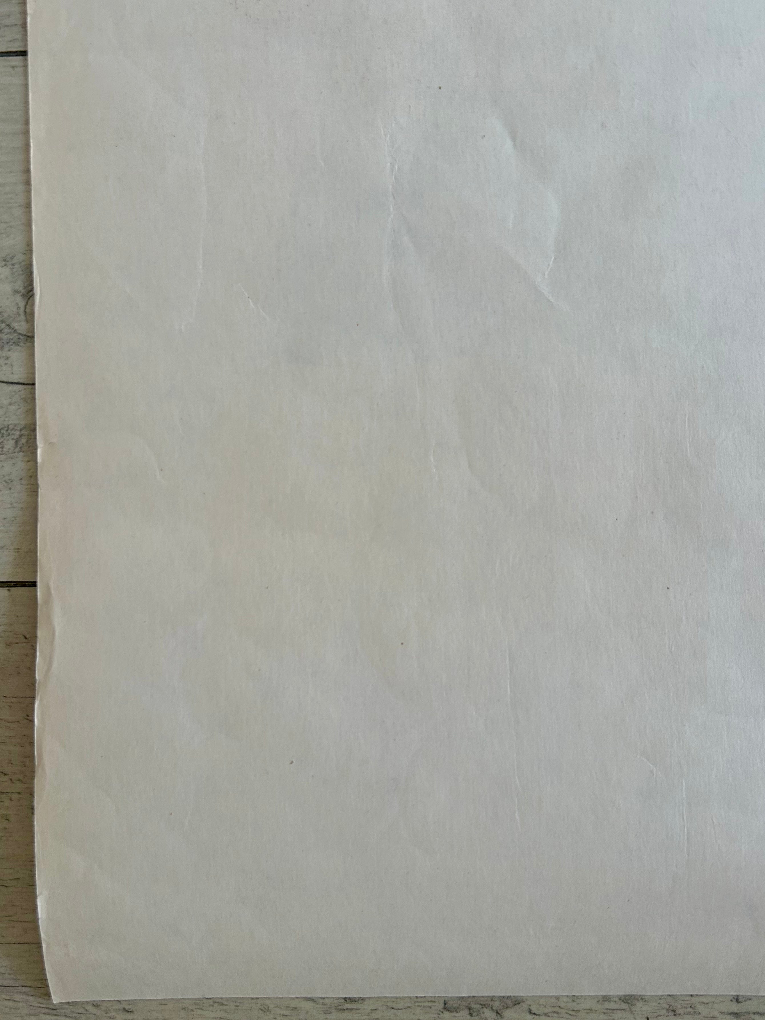 Beige paper on a wooden surface