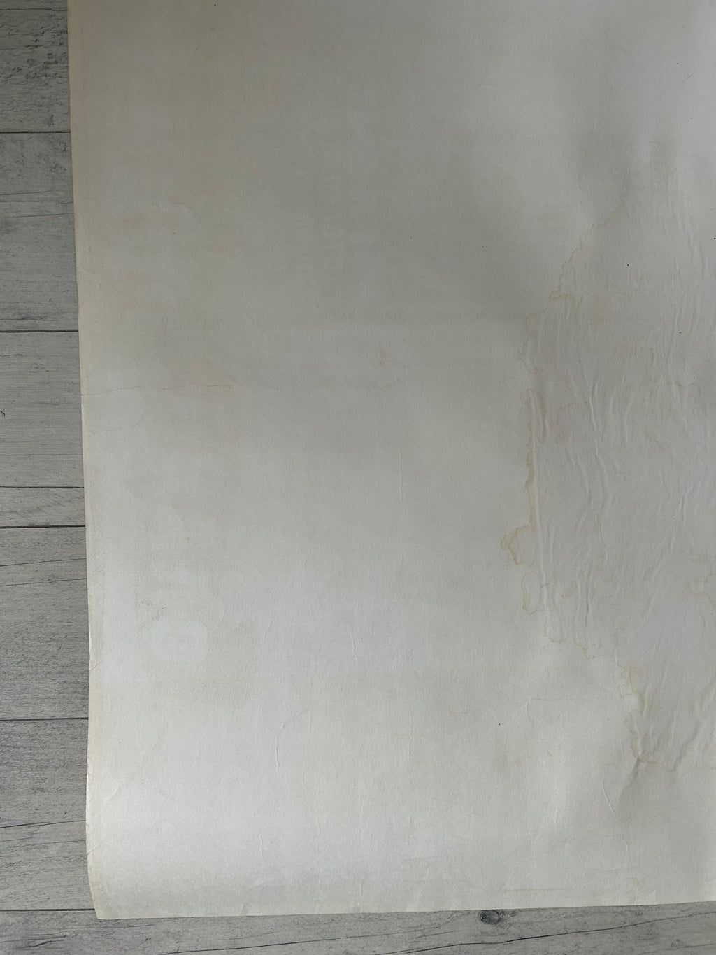 Sheet of beige paper on a wooden surface