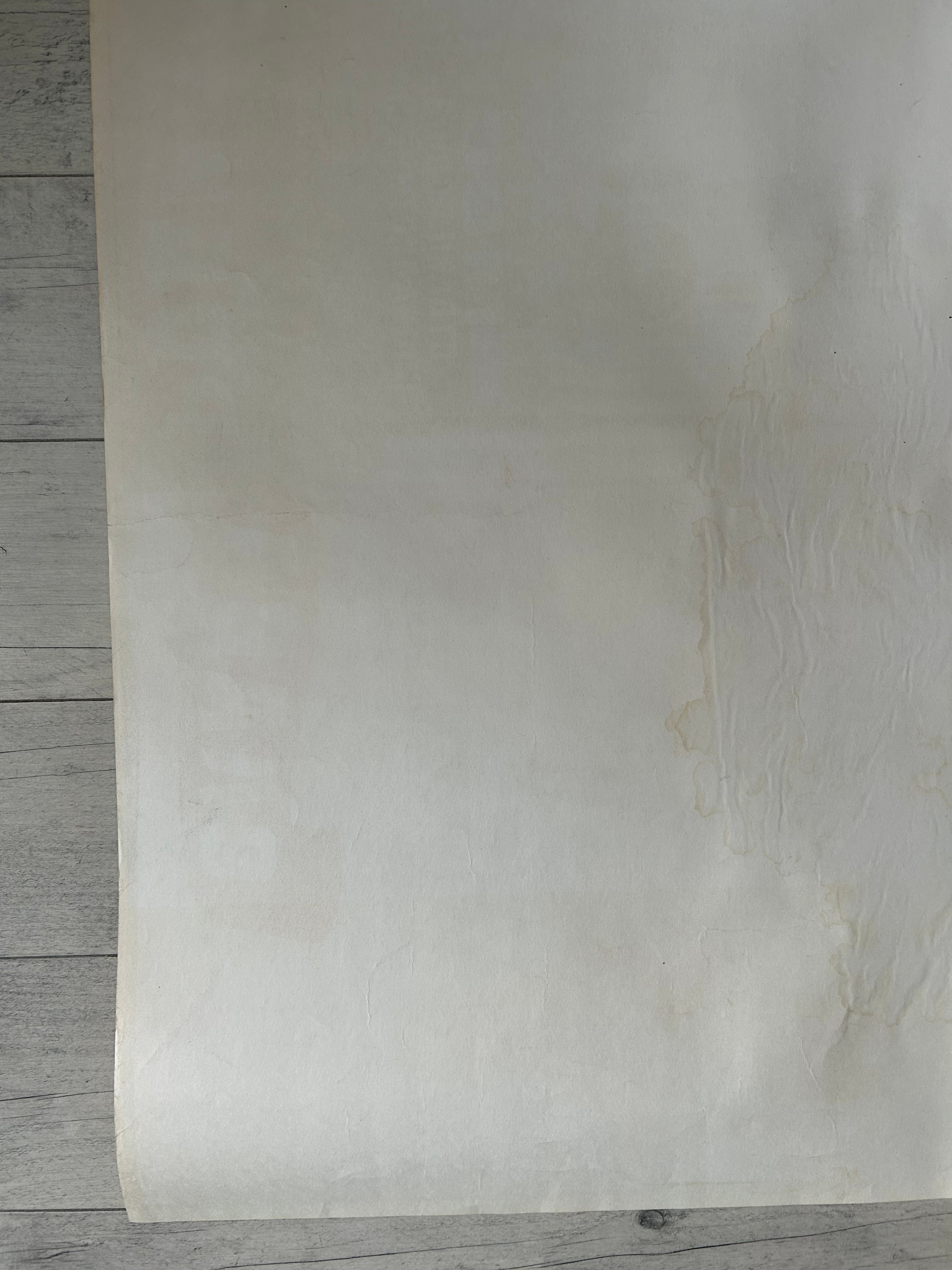 Sheet of beige paper on a wooden surface