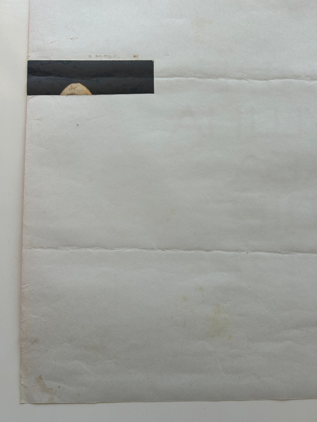 White marble surface with a black rectangular patch