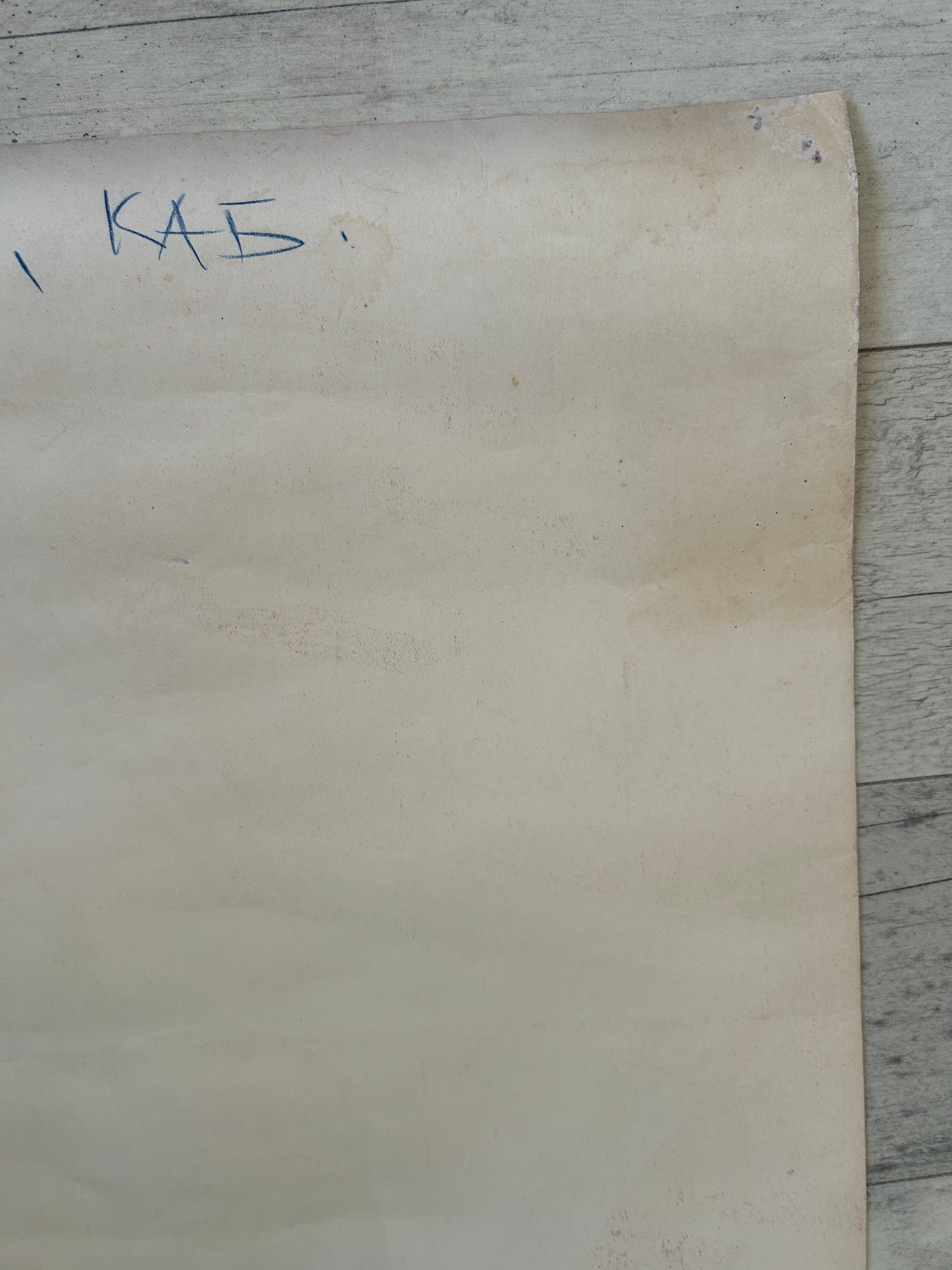 Sheet of paper with writing on a wooden surface
