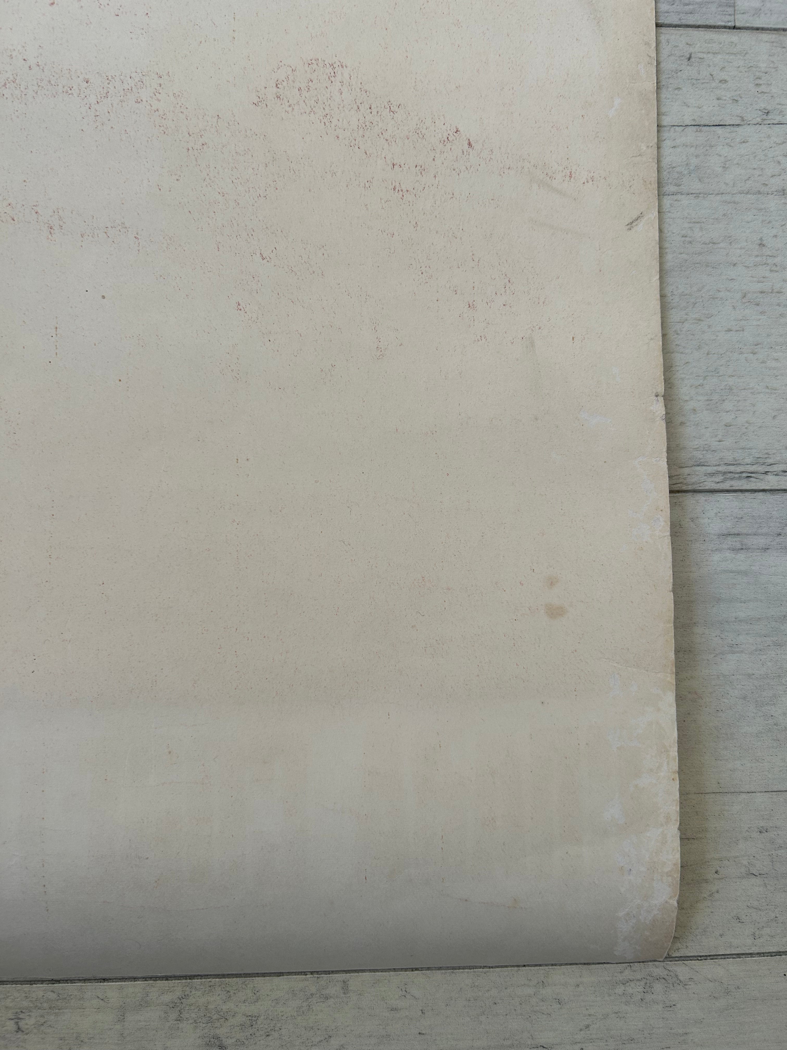 Close-up of a textured white surface with a wooden floor in the background
