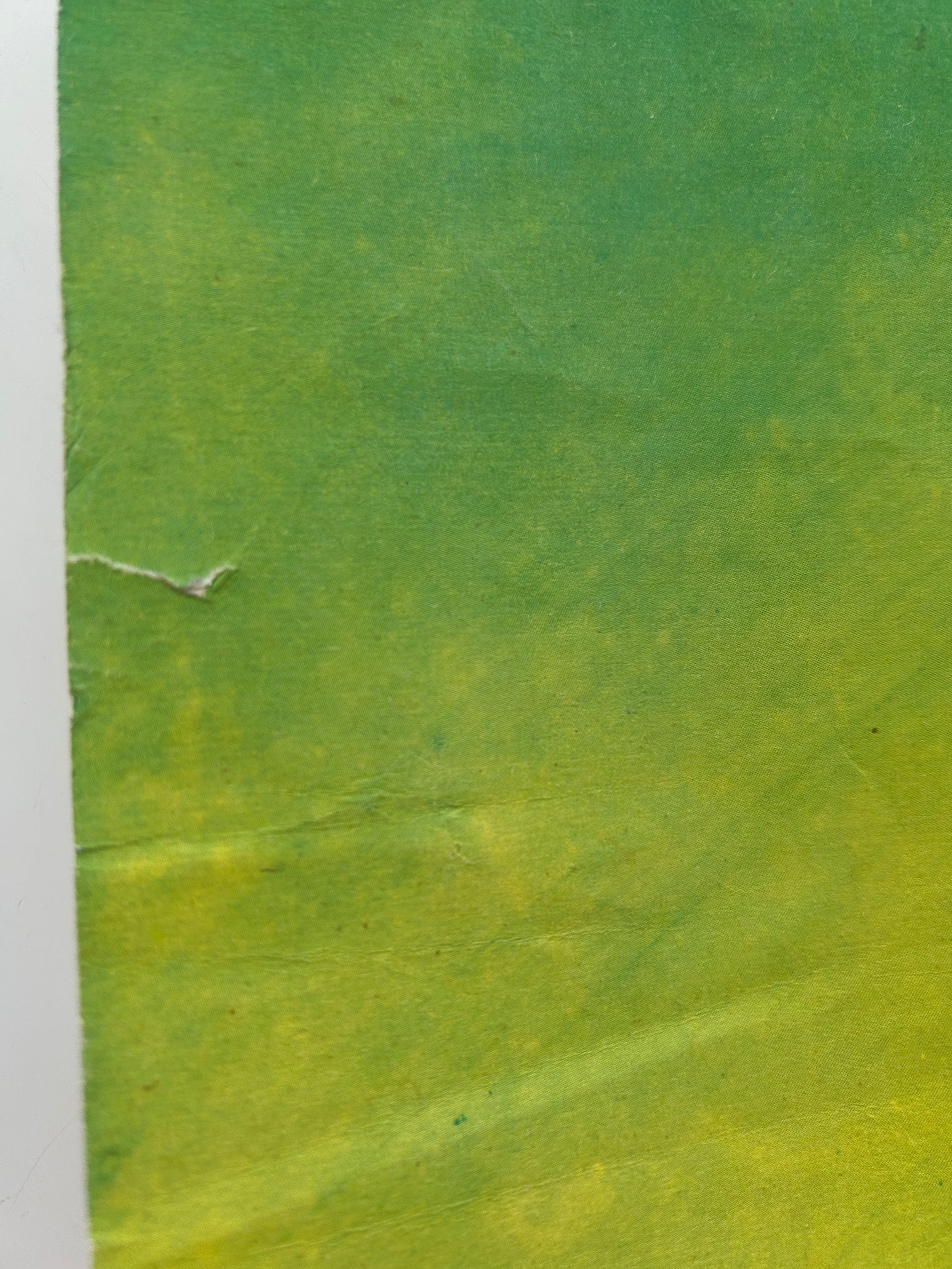 Textured green and yellow paper with a white border